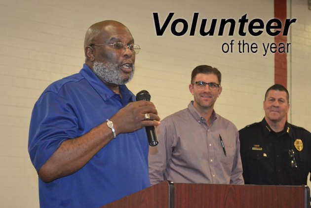 Lemoore Parks and Recreation Department's Volunteer of the Year Dr. Ernie Smith, flanked by the Community Services Director Jason Glick and Police Chief Darrel Smith.